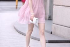 With pale pink high heels and white mini clutch