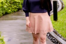 With pale pink skirt and white lace up shoes