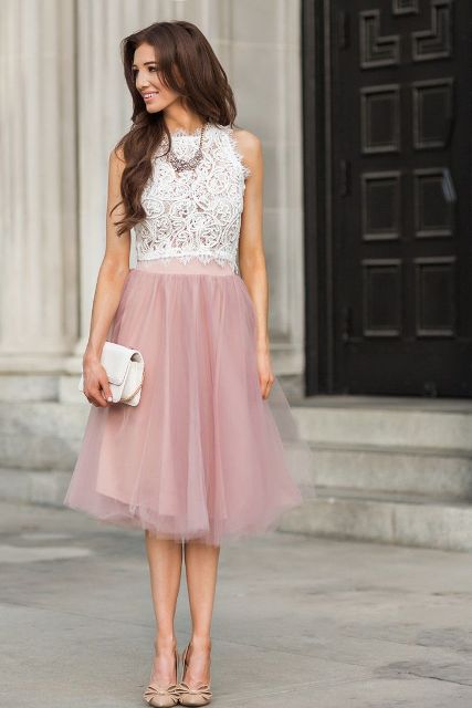 With pale pink skirt, white clutch and beige shoes