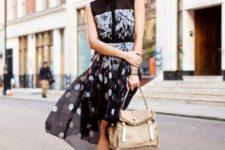 With printed dress and beige bag