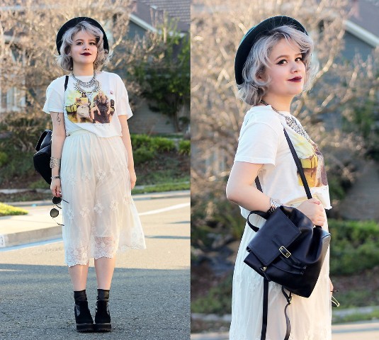 With printed t-shirt, lace midi skirt, black hat and black boots