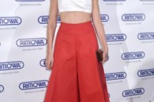 With red culottes, red sandals and mini clutch