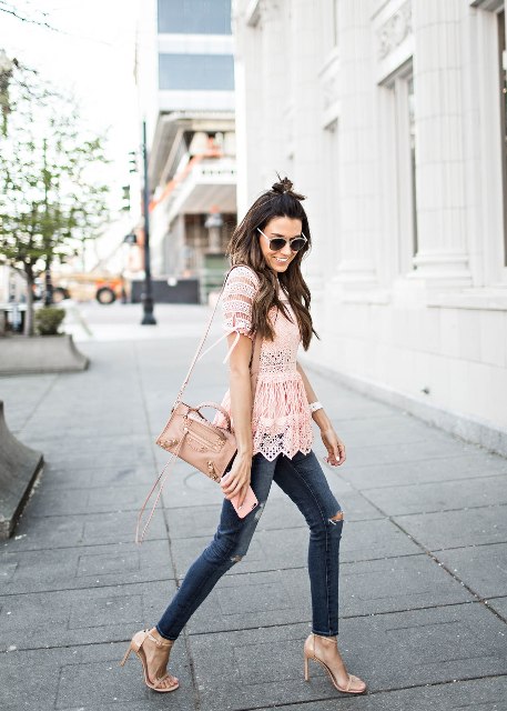 With skinny jeans, high heels and beige bag