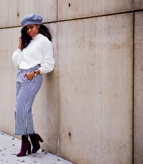 With striped culottes, purple boots and hat