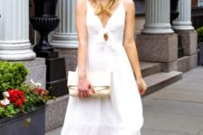 With white clutch and beige pumps