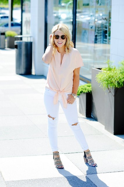 With white distressed pants and sandals