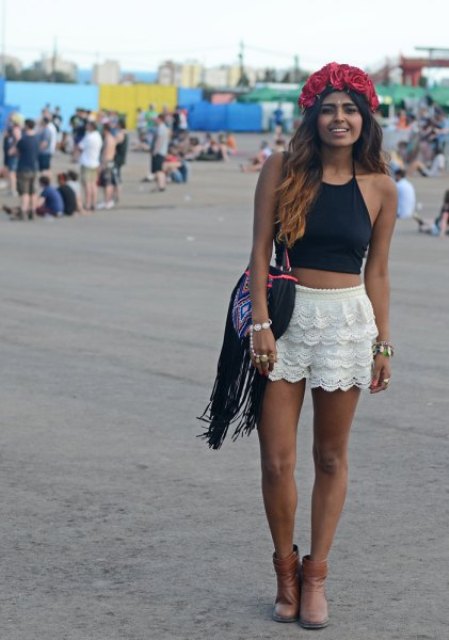 With white lace shorts, fringe bag and ankle boots