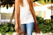 With white long top, skinny jeans and brown lace up sandals