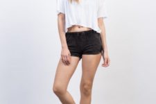 With white loose crop shirt, cap and low heeled shoes