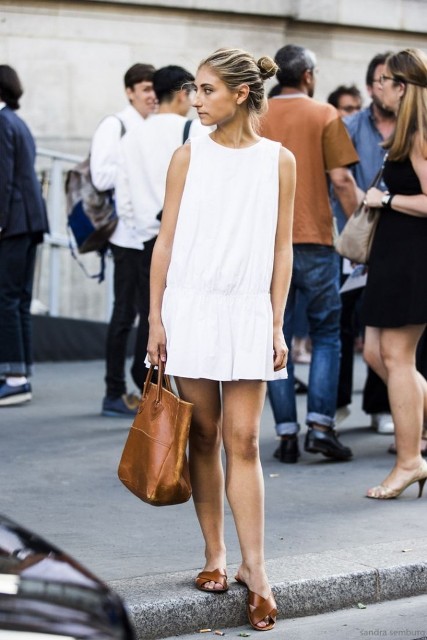 With white mini dress and brown leather flat sandals