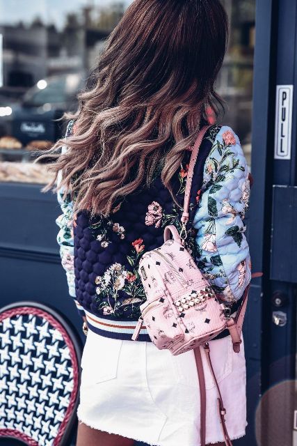 With white mini skirt and floral jacket