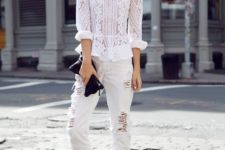 With white pants, lace up sandals and black clutch