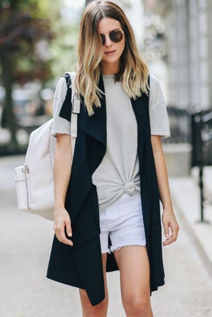 With white shorts, black long vest and white backpack