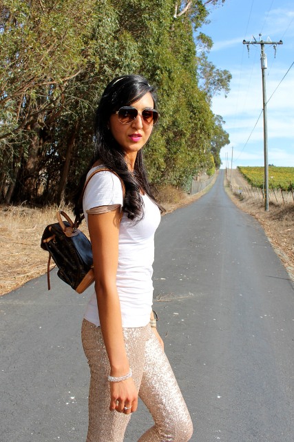 With white t-shirt and metallic pants