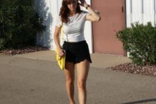 With white t-shirt, yellow pumps and yellow bag