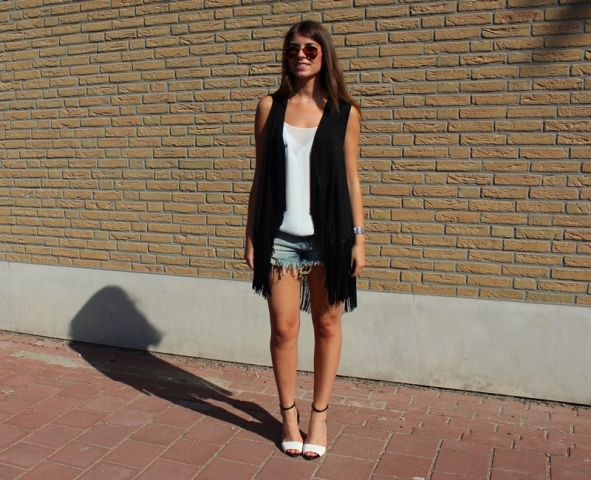 With white top, denim mini shorts and black and white high heels