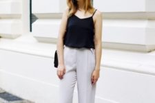 With white wide leg trousers and black bag
