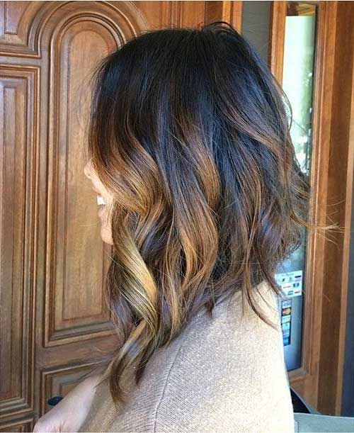 a long bob with black to bronde balayage waves and asymmetry