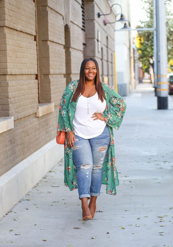 blue ripped jeans, a white top, a green floral kimono, orange shoes and a bag