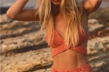 16 an orange crochet bikini set with a criss cross top and a high waisted bottom
