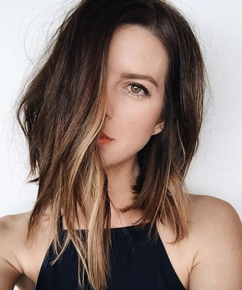 chestnut long bob with asymmetry and textural waves plus balayage for a summer feel
