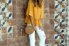 white ripped jeans, a yellow lace up top, polka dot flats, a hat and a round wicker bag