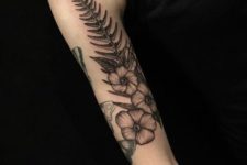Big fern tattoo on the arm