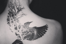 Bird and tree tattoo on the back and neck