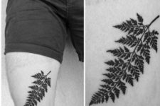 Black fern tattoo on the leg
