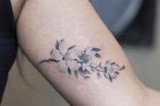 Cherry blossom tattoo design on the arm