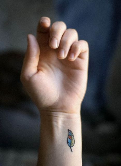 Colorful leaf tattoo on the wrist