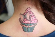Cupcake and bow tattoo on the neck