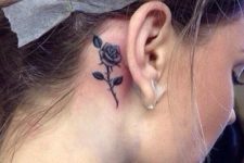 Cute rose tattoo behind the ear