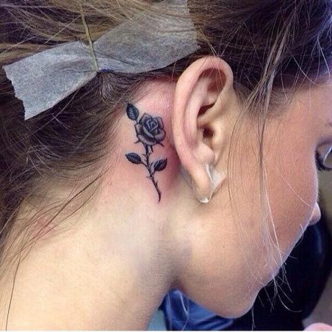 Cute rose tattoo behind the ear