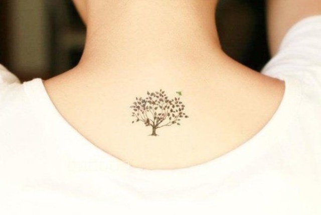 Cute tiny tattoo on the neck