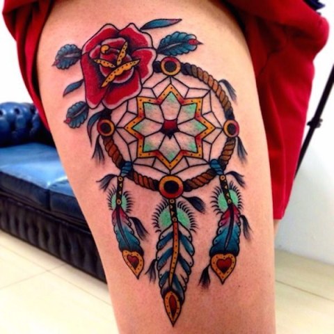 Dreamcatcher and rose tattoo on the leg