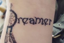 Dreamer tattoo on the wrist