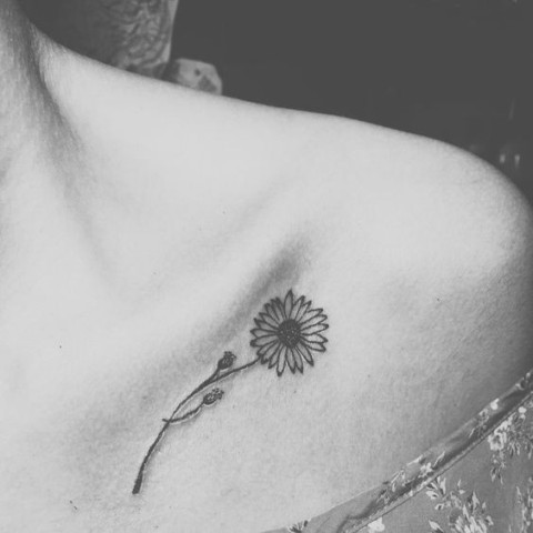 Elegant floral tattoo on the shoulder