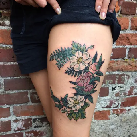 Fern with colorful flowers tattoo