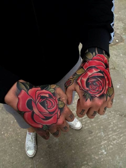 Gorgeous rose tattoos on both hands