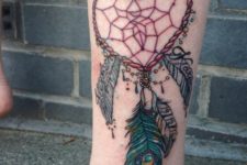 Heart shaped dreamcatcher tattoo on the leg