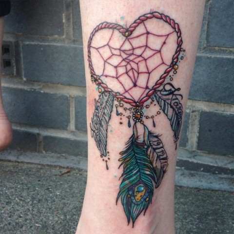 Heart shaped dreamcatcher tattoo on the leg