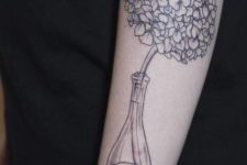 Hydrangea in the bottle tattoo on the arm