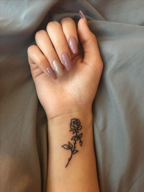 Minimalistic tattoo on the wrist