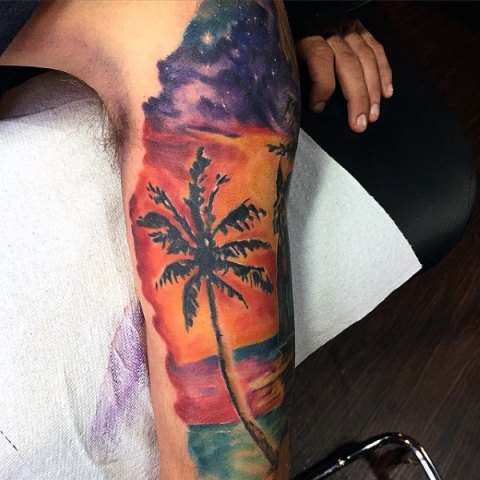 Palm tree tattoo on the shoulder and arm