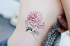 Pink hydrangea tattoo on the side