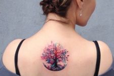 Pink, purple and lilac tree tattoo on the back