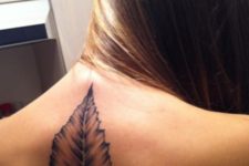Realistic leaf tattoo on the back