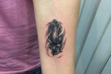 Realistic tulip tattoo on the forearm