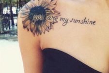 Tattoo with phrase on the shoulder